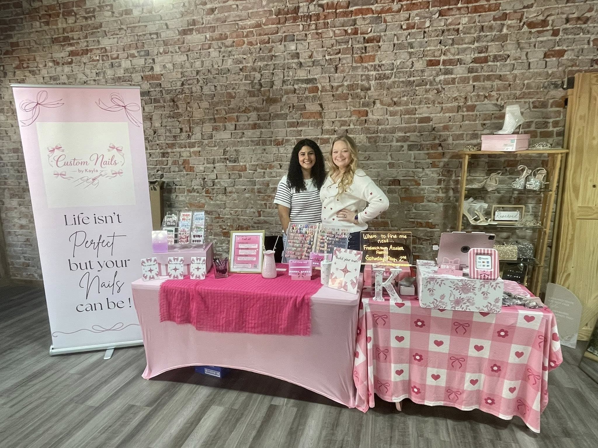 Kayla at a pop-up event with a friend