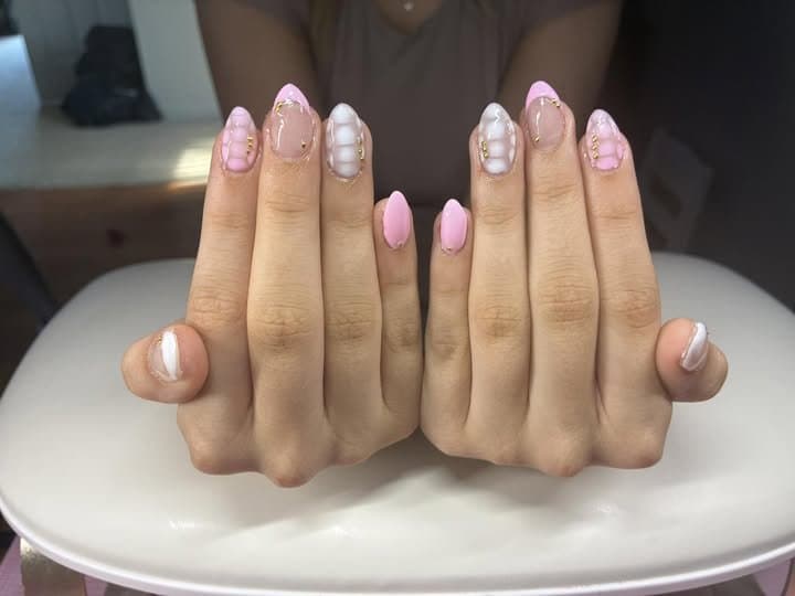 Pink and white press-on nails with 3D bubble texture
